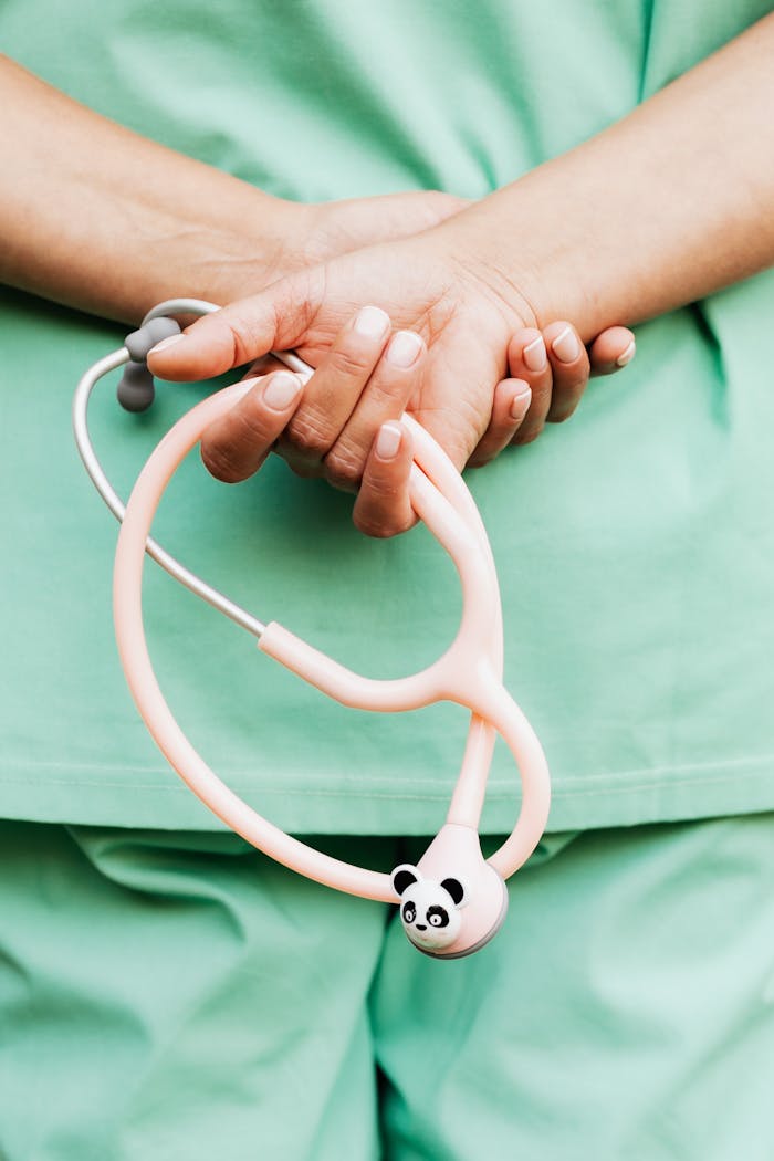 gallery-2 Close-up of a medical professional holding a panda-themed stethoscope, showcasing healthcare tools.
